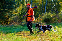 Hunter with dog, France.