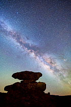 Balanced rock hoodoo in Echo Canyon silhouetted against the rising Milk Way. Chiricahua National Monument, Arizona, USA, April.