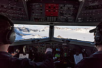 View from cockpit of Transantarctic  mountains taken en route  from the South Pole to Union Glacier.  Mount Vinson, the highest mountain in the Antarctic in background.