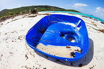 Discarded plastic rubbish on a beach in tourist destination. Lizard Island, Great Barrier Reef, Queensland, Australia. July 2012.