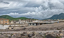 Montserrat, Exclusion Zone V, old capital town Plymouth destroyed by volcano. The Volcano is still active, with volcanic gas and dust visible in the sky. June 2012