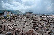 Montserrat, Exclusion Zone V, old capital town Plymouth destroyed by volcano. Volcano is still active, with volcanic gas and dust visible in the sky. June 2012