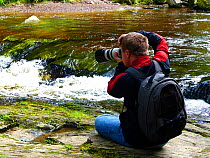 Oliver Hellowell taking pictures of Dartmoor stream, Devon, England, UK, August.
