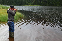 Photographer Oliver Hellowell taking pictures at Loch Dunmore, Perthshire, Scotland, UK. August 2014