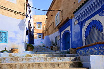 Alleyway between buildings in Chefchaouen, known as The Blue Pearl of Morocco, Chefchaouen Province, Morocco. April 2018.