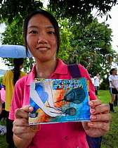Secondary school student shows post cards they have made at the release event of juvenile Horseshoe crab ( Tachypleus tridentatus) artificially-bred by City University of Hong Kong. Ha Pak Nai Wetland...