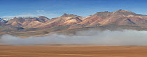 Rhyolite mountains above low cloud, Siloili Desert, Eduardo Avaroa Andean Fauna National Reserve, Sur Lipez Province, Bolivia. March 2017.