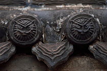 Tiger or owl faces in roof tiles. Details from the Yong An Si temple, now a museum, Beiyue Hengshan Mountain, Datong, Hunyuan County, Shanxi Province, China