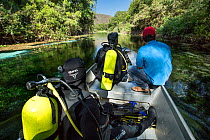 Scouting the river on a small boat driven by an electric motor ready to dive, Formoso River, Bonito, Mato Grosso do Sul, Brazil