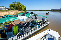 Boat loaded to travel the Paraguay river for exploration, Pantanal, Brazil