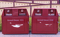 Waste and recycling bins with illustration showing decline in extent of Grinnell Glacier between 1910 and 2008. Glacier National Park, Montana, USA. August 2018.