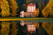Sneznik Castle reflected in floodwater, near Kozarisce, Notranjska, Slovenia. October 2012