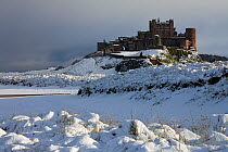 Bamburgh Castle in the snow, Northumberland, England, UK. November 2010