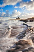 Long exposure of waves near Bamburgh Castle, Northumberland, England, UK. December 2012