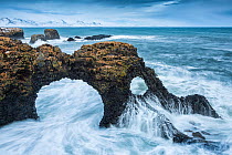 Natural sea arch with long exposure of waves, Gatklettur, Arnarstapi, Iceland. December 2013