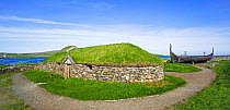 Reconstruction of Norse Viking longhouse and the Skidbladner, a full size replica of Gokstad ship at Brookpoint, Unst, Shetland Islands, Scotland, UK, May 2018
