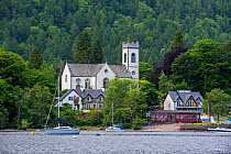 Kenmore Parish Church and sailing boats in Loch Tay, Perth and Kinross, Perthshire in the Highlands of Scotland, UK, 2018