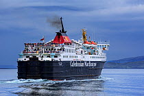 Passengers on deck of the Caledonian MacBrayne ferry boat Isle of Mull / An t-Eilean Muileach leaving the port of Oban, Scotland, May 2018