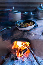 Cooking food over open fire, Nepal
