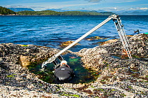Using a specialist motion control rig to film underwater timelapse in a rockpool. On production for BBC Blue Planet II, Vancouver island, British Columbia, Canada, July.