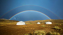 Double rainbow over traditional gers / yurts, steppe grassland, Altanbulag, Mongolia, June 2017.