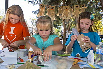 Children, supporters of Martinez Beavers, making beaver crafts. Martinez, California. September 2015. Model released.