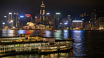 Timelapse of Kowloon Star ferry station, with passengers boarding and ferry leaving, Hong Kong, China, 2016.