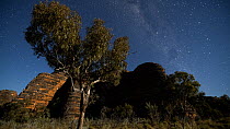 Tracking timelapse from day to night of sandstone tower karst terrain, lit by the moon, with stars and the Milky Way, Bungle Bungle Range, Purnululu National Park, Western Australia, 2016.