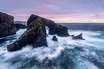 Stac a' Phris rock arch at high tide, sunset, The Isle of Lewis and Harris, Outer Hebrides, Scotland, UK. October 2018.
