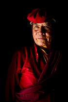 Portrait of a Buddhist Lama / teacher in traditional costume, Hemis Buddhist Monastery, India. September 2018.