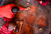 Monks starting to draw a mandala, Thikshey monastery, a Tibetan Buddhist gompa, Ladakh, India, September 2018.