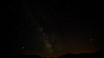 Timelapse of stars, showing Scorpius, Sagittarius and the planet Mars, with airplanes, Alpes de Haute Provence, France, August.