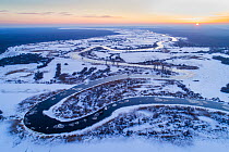 Winter sunrise over freezing Suur Emajogi River. Alam-Pedja Nature Reserve, Tartumaa, Southern Estonia. January 2018.