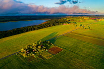 Fields within the Vooremaa Landscape Protection Area in evening light, aerial view. Tartumaa, Southern Estonia. June 2017.