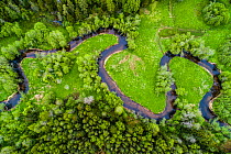 Meandering Loobu River with surrounding meadows and woodlands, aerial view. Lahemaa National Park in Northern Estonia in Laane-Virumaa, Estonia. May 2017.