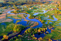 Spring flooding of Mustjogi River and surrounding meadows, aerial view in evening light. Border of Estonia and Latvia. May 2016.