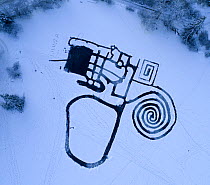 Skating area labyrinth surrounded by snow, aerial view. Akershus, Norway. December 2017.