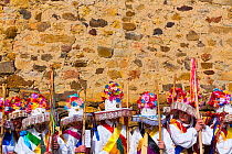 Men in colourful costumes at Carnival of Zamarrones, Belmonte village, Polaciones valley, Cantabria, Spain. February 2013.