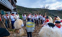 Men in traditional costumes with sheep skins celebrating &#39;Las Marzas&#39; celebration, Soba Valley, Cantabria, Spain. March 2017.