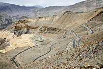Road climbing the Nako pass in Spiti valley, Himalaya mountains, Himachal Pradesh, India, February