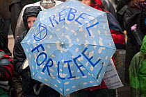 Umbrella with Rebel for Life on it - Climate change protest at Extinction Rebellion action in Carmarthen Wales, December 2018.