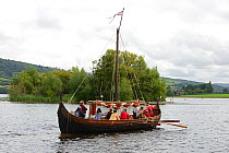 Replica Viking longboat on Llangorse Lake and the Crannog, a 9th Century man-made island, Brecon Beacons National Park, Breconshire, Wales, September 2018.