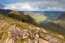 View down Coire a Chaorachain to Loch Coire Nan Arr with Loch Kishorn in distance. Wester Ross, Highlands, Scotland, UK.