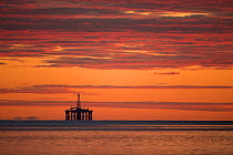 Oil rig sihouetted at dawn. Moray Firth, Scotland, UK.