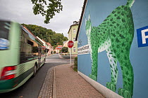 Mural on wall as part of Eurasian lynx (Lynx lynx) branding in town. Bad Schandau, Germany.