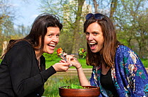 Women enjoying a vegan picnic, North London, England, UK, March 2019. Model released.