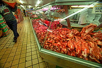 Butcher counter in supermarket, north London, England, UK.