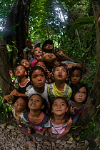 Young children from Barangay Tagabinet having a nature walk around Ugong Rock, Palawan, the Philippines.