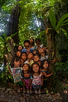 Young children from Barangay Tagabinet having a nature walk around Ugong Rock, Palawan, the Philippines.