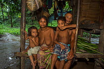 Batak family in their house in their village in the forest, Sitio Kalakwasan, Cleopatra&#39;s Needle Critical Habitat, Palawan, the Philippines. October 2016.